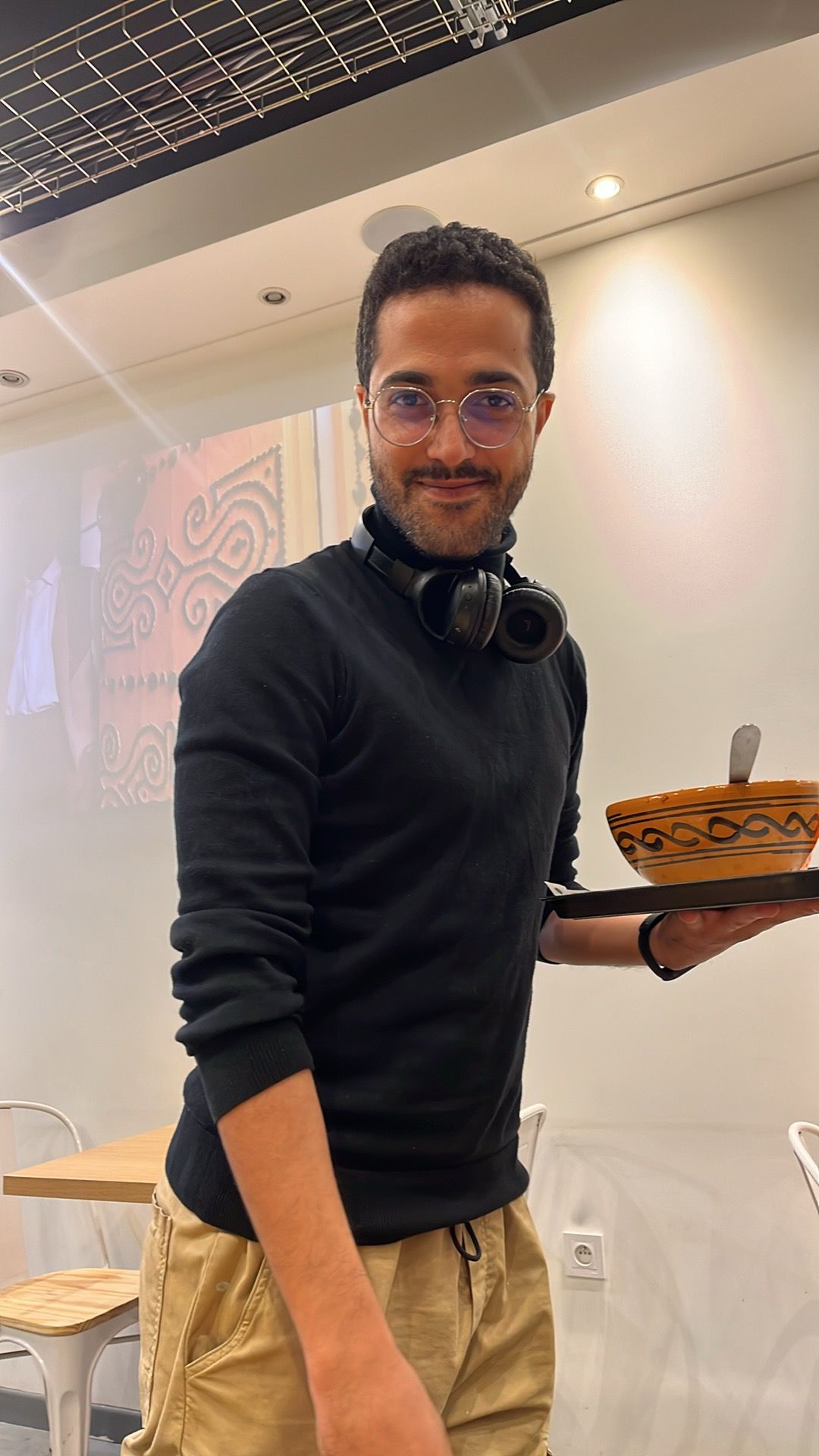 proudly holding a tagine